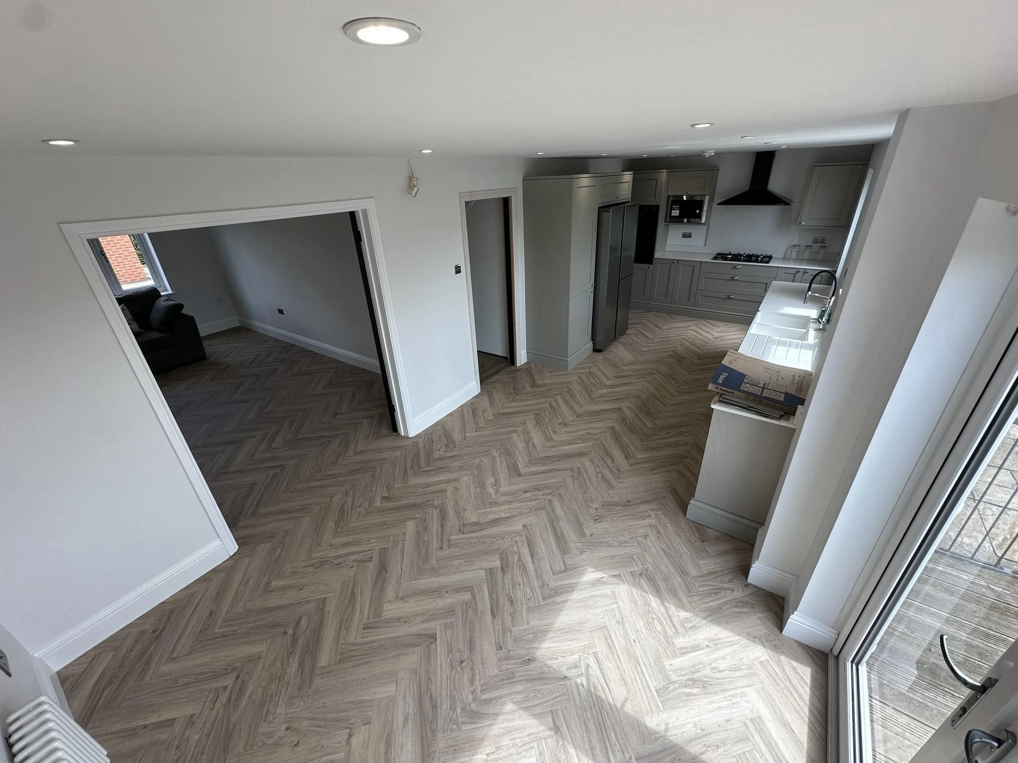 Luxury vinyl tile flooring showing realistic wood grain pattern in a residential setting